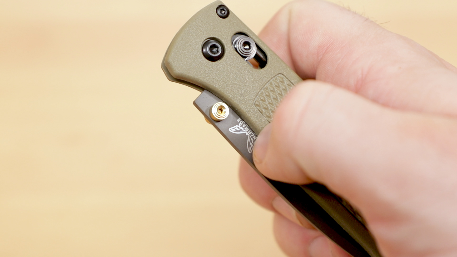 Benchmade Bugout with finger on the thumb stud