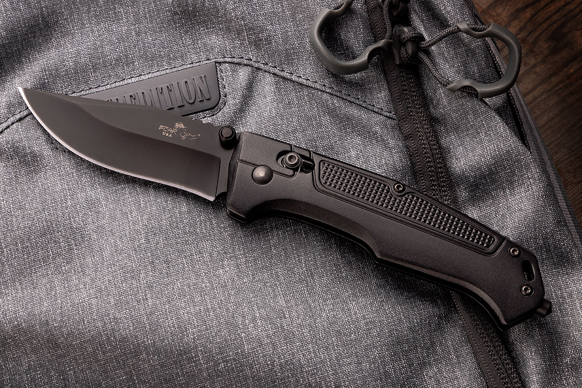Bear OPS Rancor IV Clip Point Knife on Gray Backpack