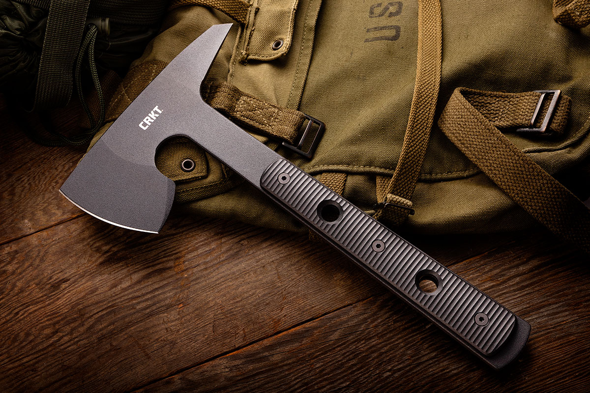 CRKT RMJ Tactical Rune Tomahawk sitting on a canvas rucksack