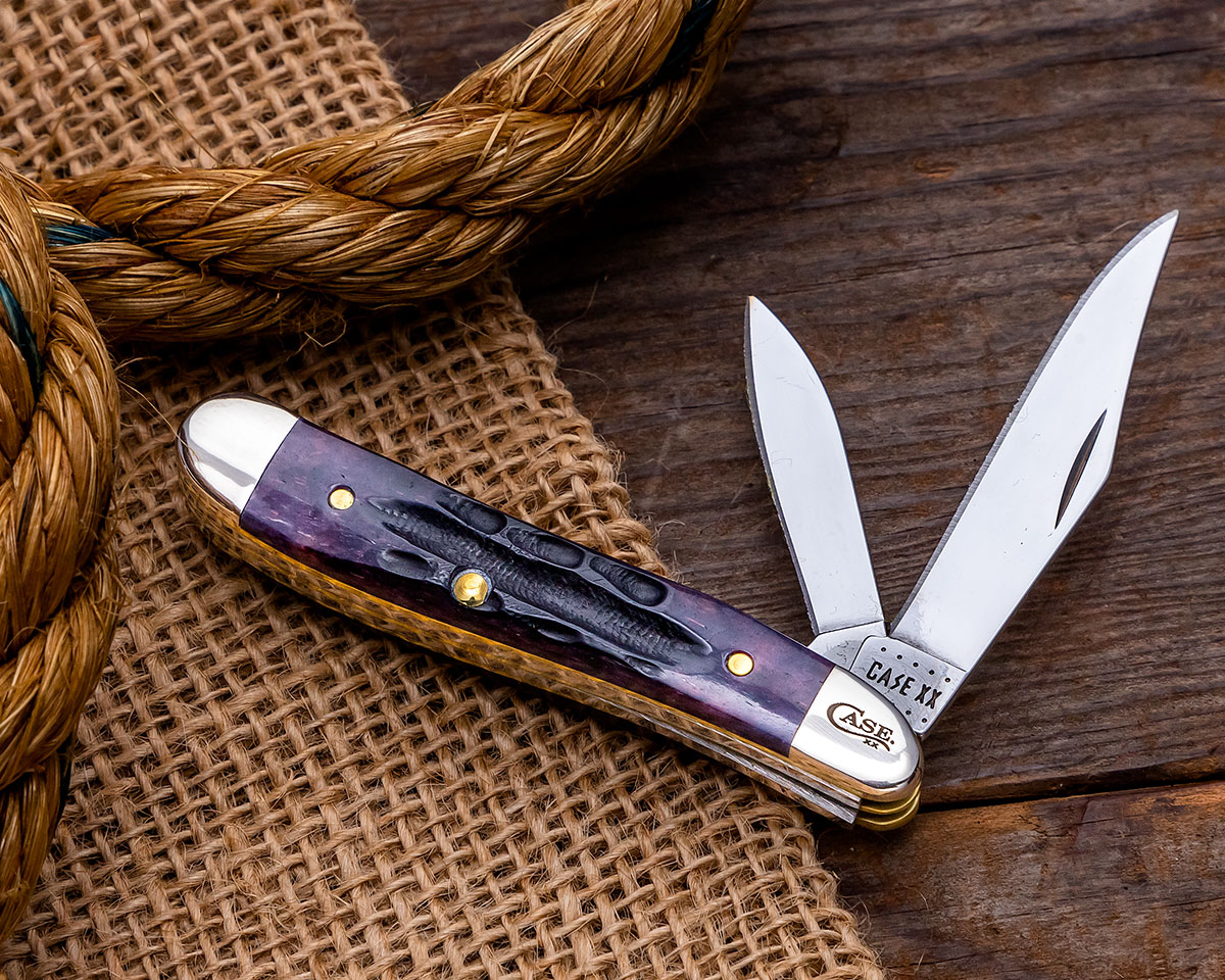 Case Deep Canyon Light Purple Jigged Peanut on burlap with blades open