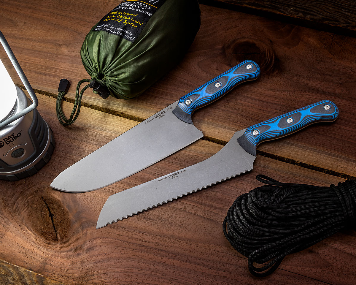TOPS Dicer Chef Knife and Bread Knife surrounded by camping gear