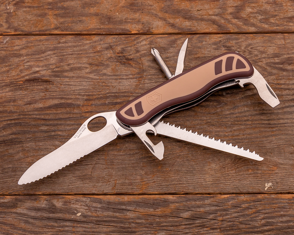 Victorinox Swiss Army OH Trekker, open on a wood plank background