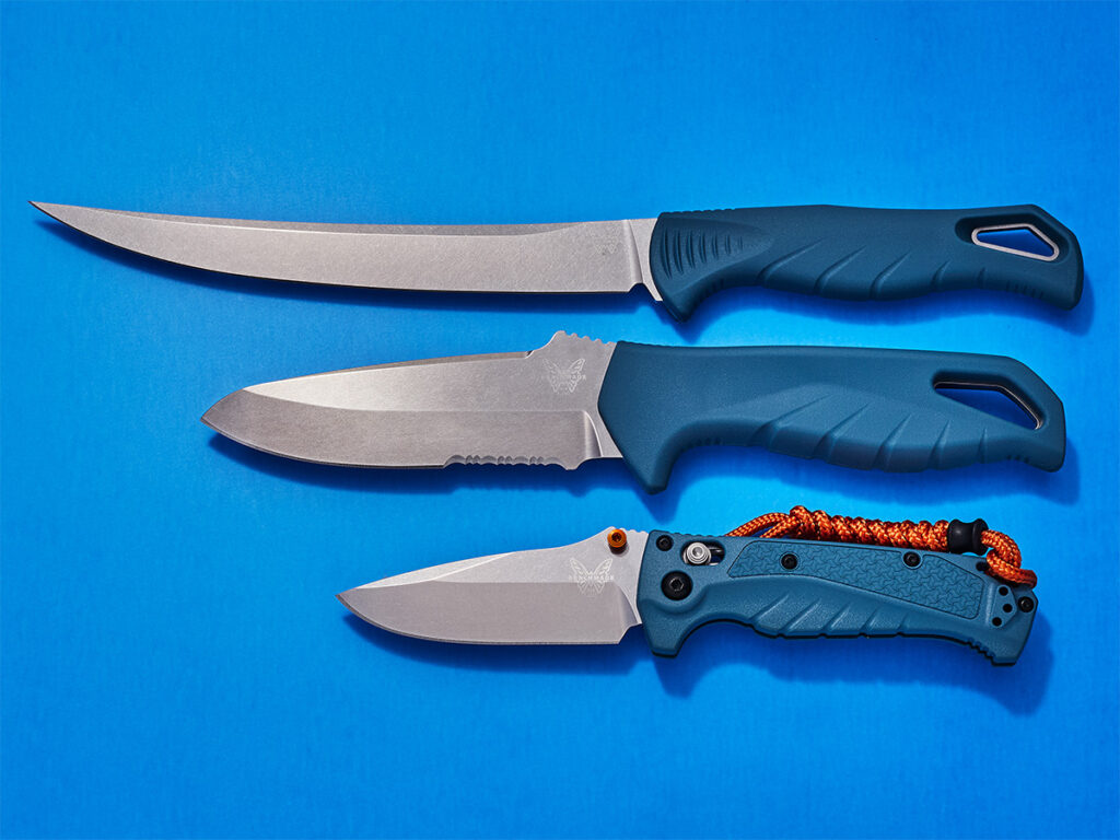 Three Benchmade Water Line knives on blue background