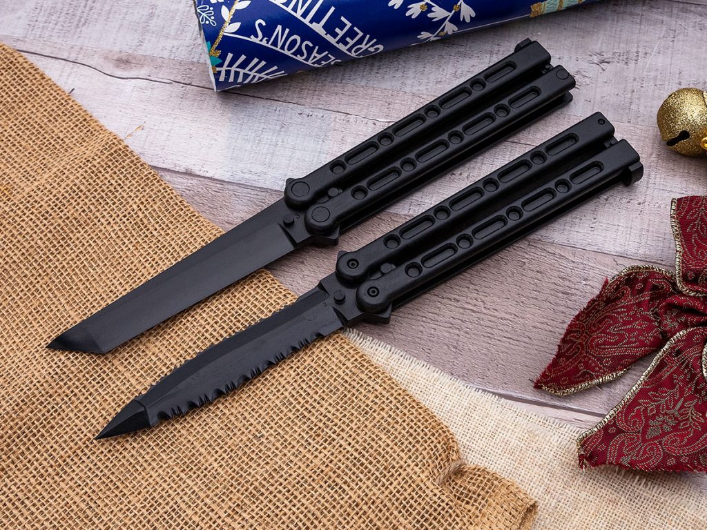 Cold Steel FGX Balisongs (butterfly knives) on a holiday themed background