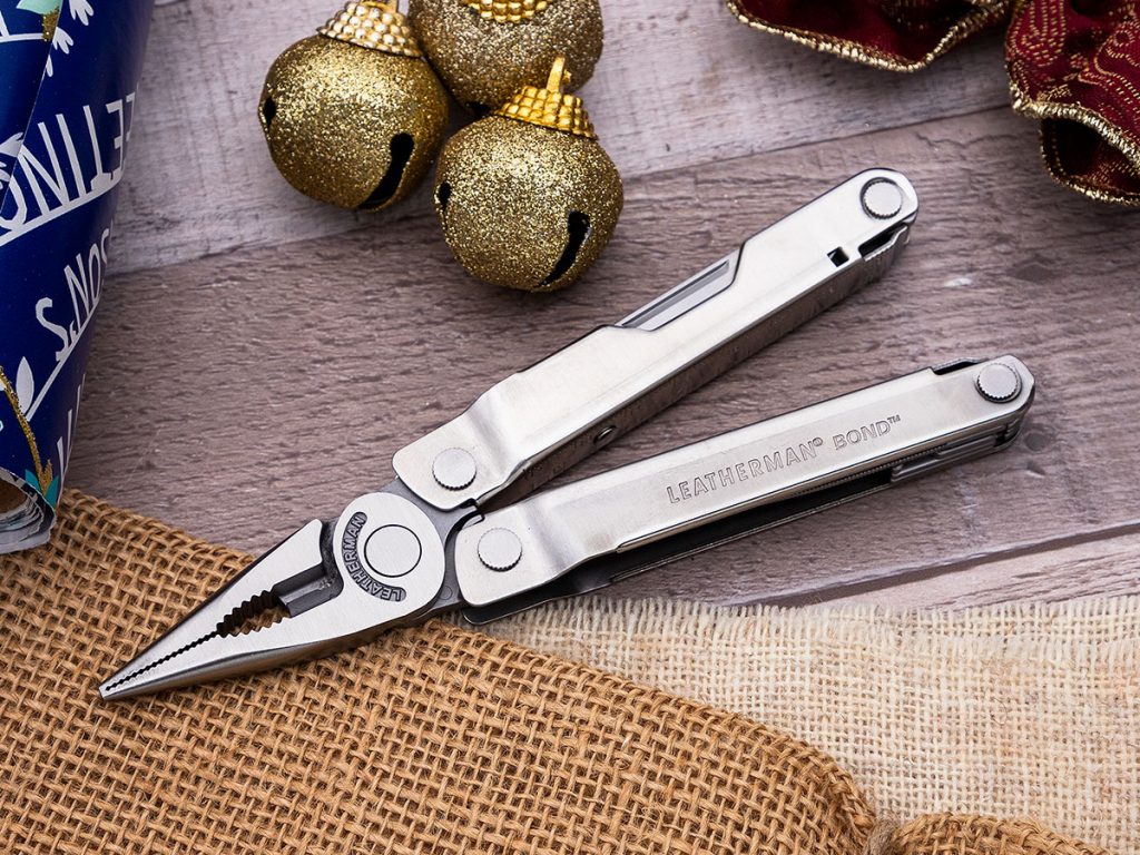 Leatherman Bond Multi-Tool open on a holiday themed background