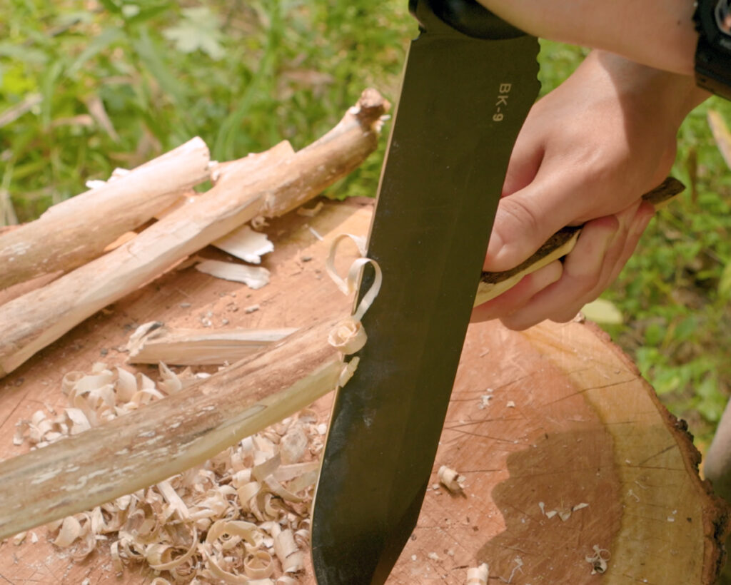 Becker BK9 knife carving wood curls from a stick