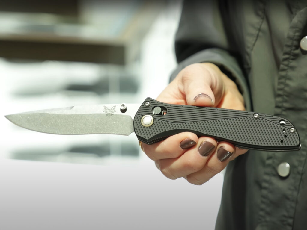 Benchmade 710 folding knife open in hand