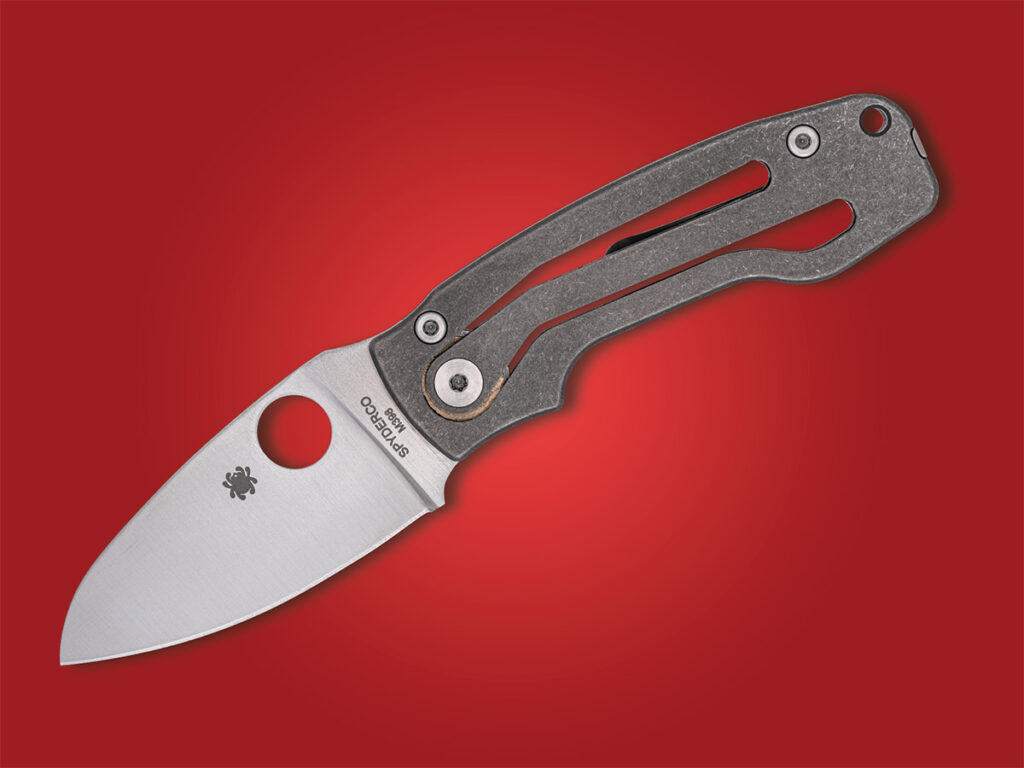 Spyderco PITS 2 folding knife open on red background