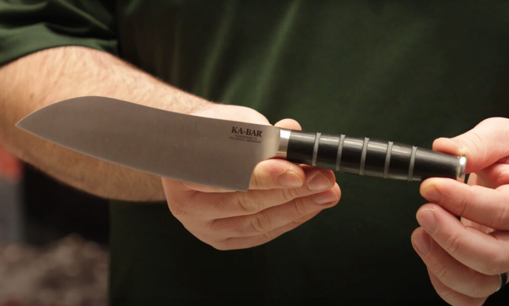 KA-BAR Santoku kitchen knife displayed in hand
