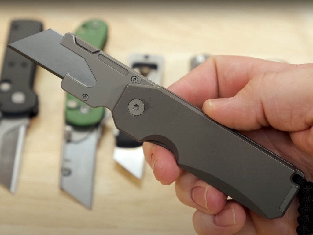 BIGiDESIGN Ti Utility Frame Lock knife displayed in hand