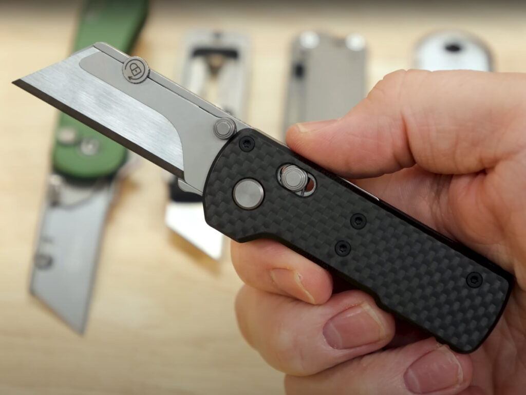 Olight Otacle U1 utility knife displayed in hand
