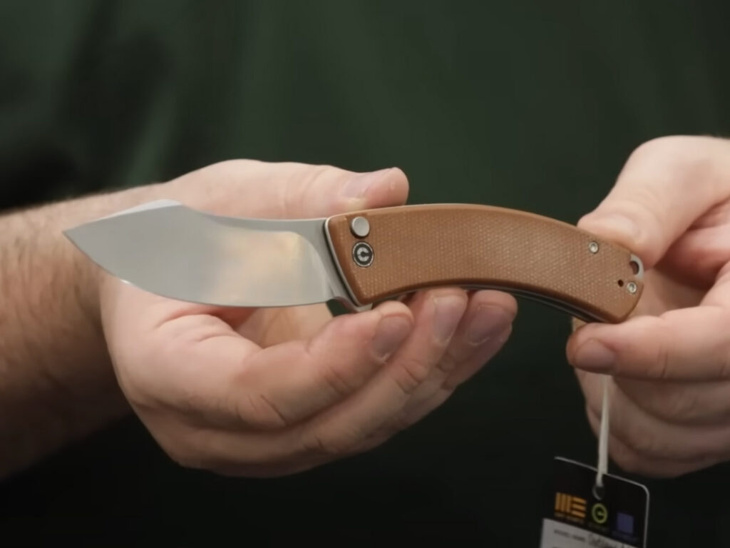 CIVIVI Outlaw Muk folding knife displayed open in hand