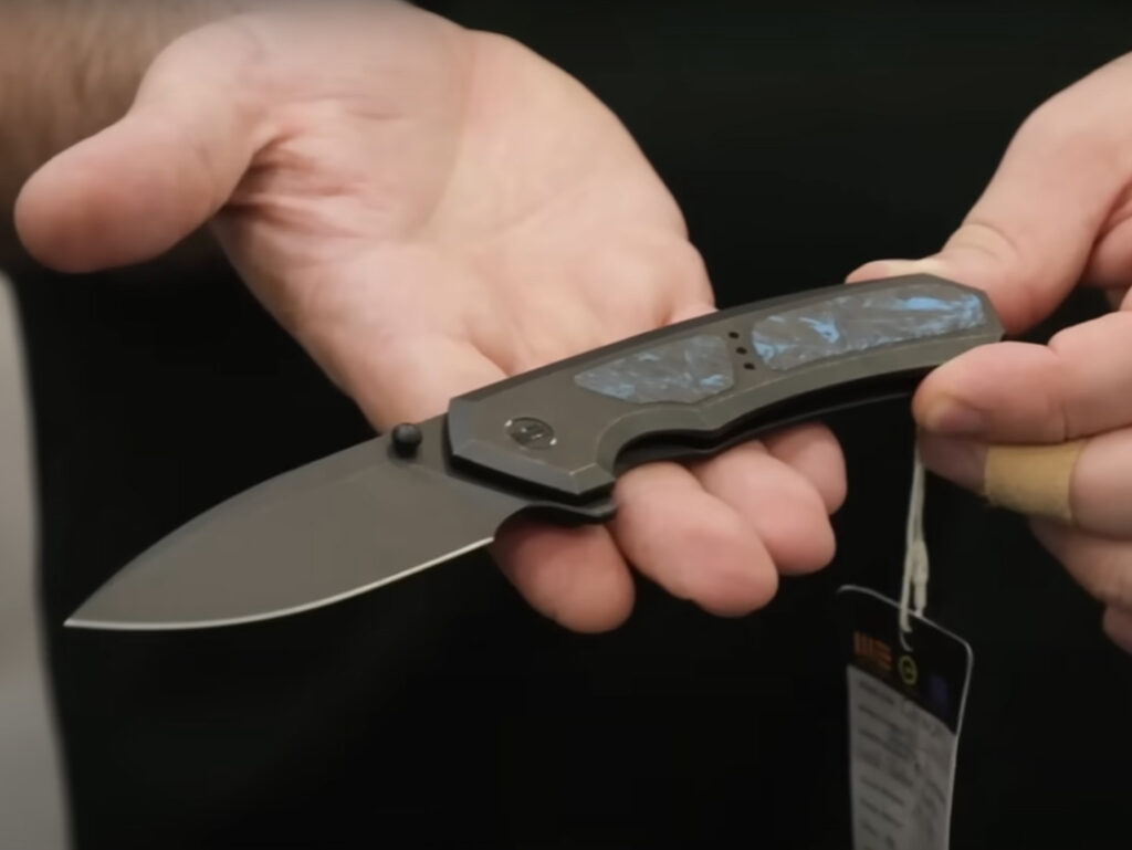 WE Corwyn folding knife displayed in hand