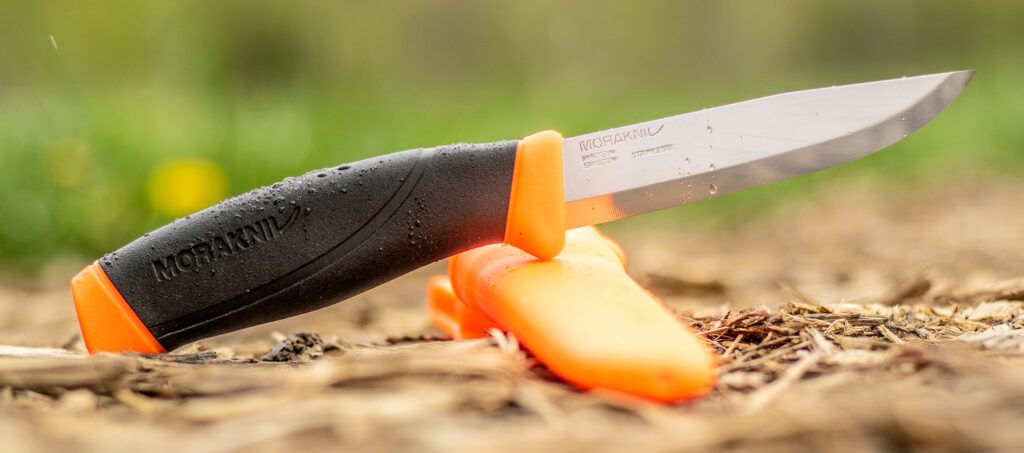 Morakniv companion knife balanced on its sheath